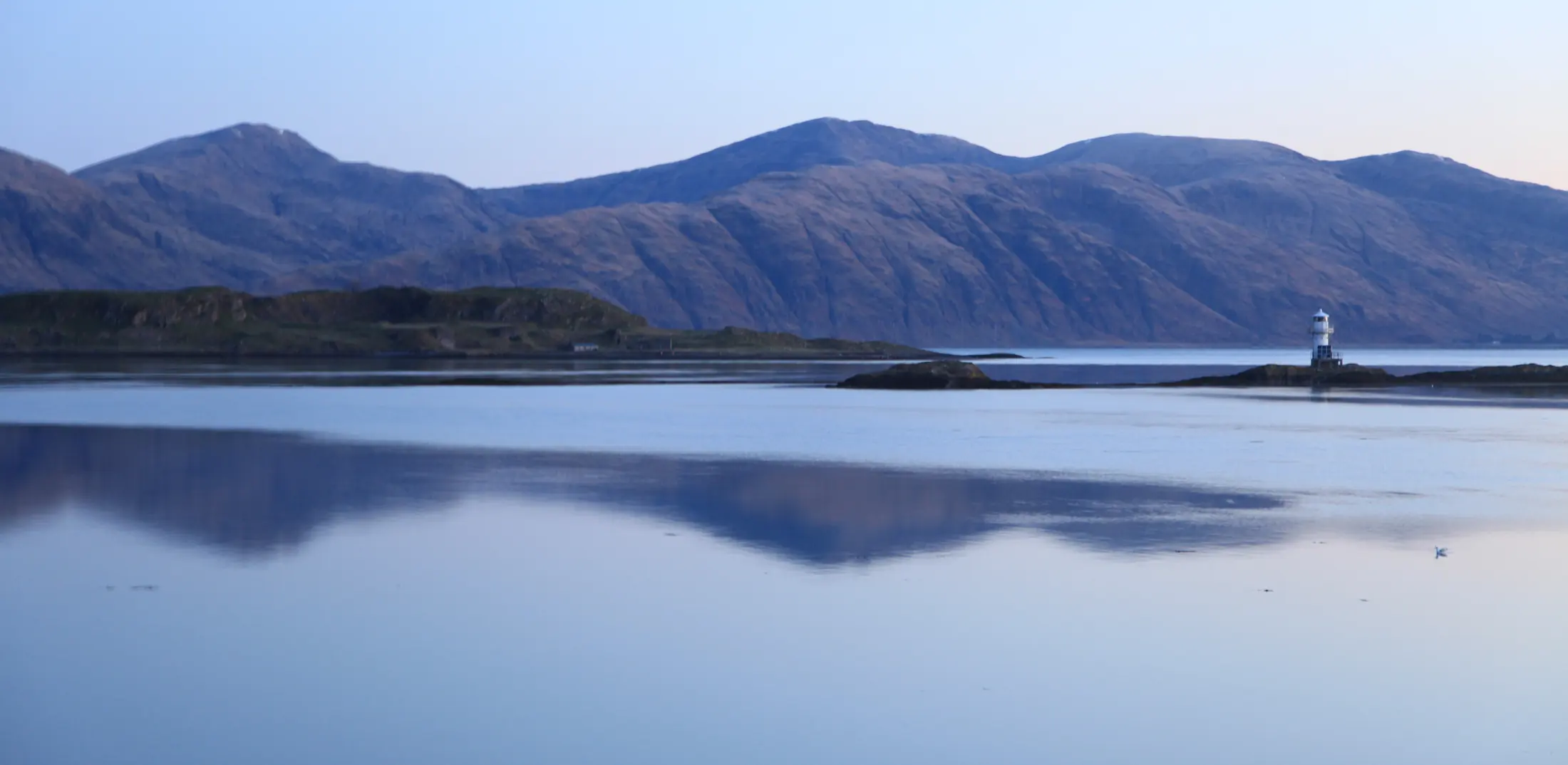 Loch Linnhe at Port Appin, still water reflecting the hills of Argyll